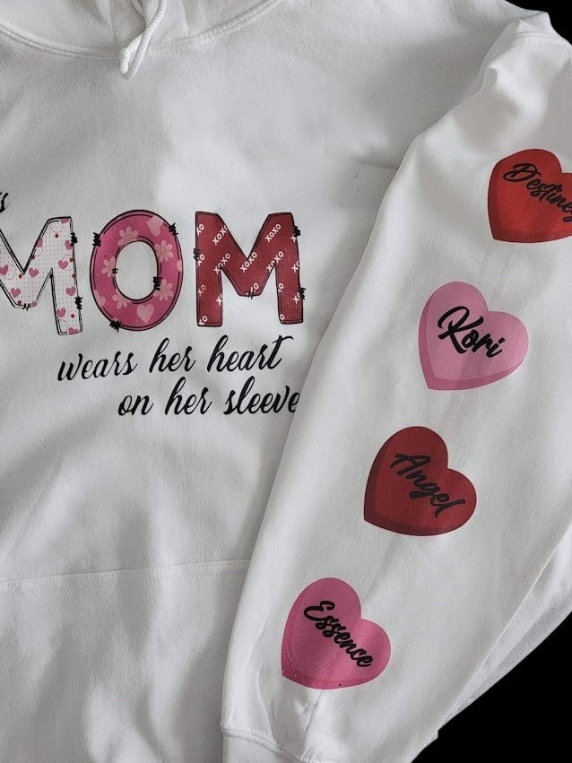 angelzessentialz white custom hoodie featuring Mom graphic and heart designs with names printed on the sleeve